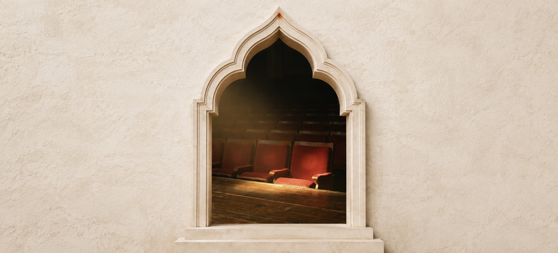 A pale Mughal-style cusped stone archway set into a cream plaster wall, opening onto a dim theatre auditorium of empty red-velvet seats — the fourth wall, framed. Breaking the Fifth Wall by Hana Mattar, Bombay Blanc, a creative production house in Singapore and Bombay.